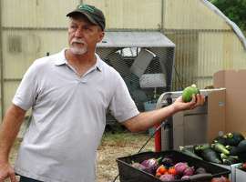 Farmer showing his vegetables AgriLife Today Flickr